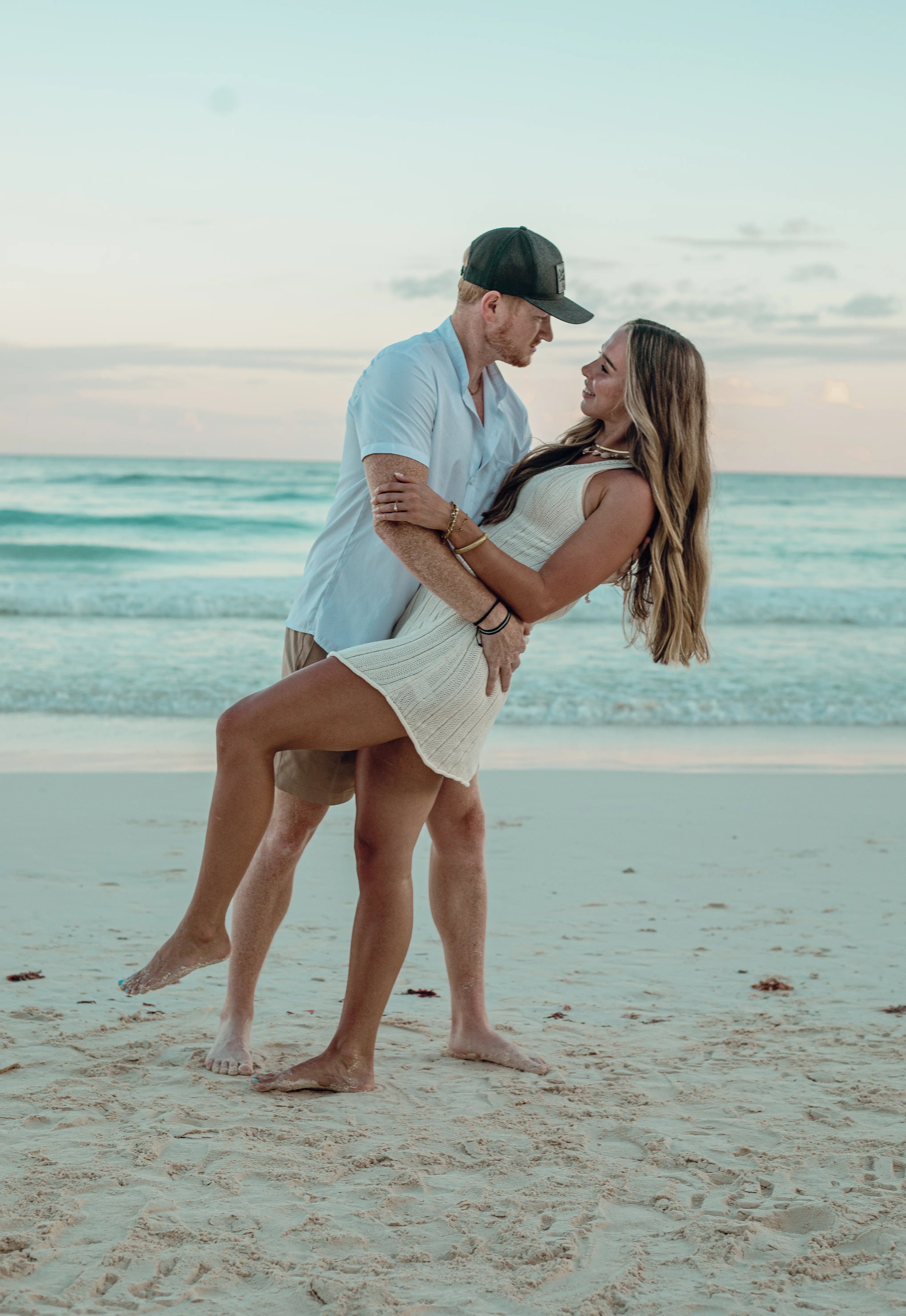 Golden hour beach proposal in Tulum at sunset