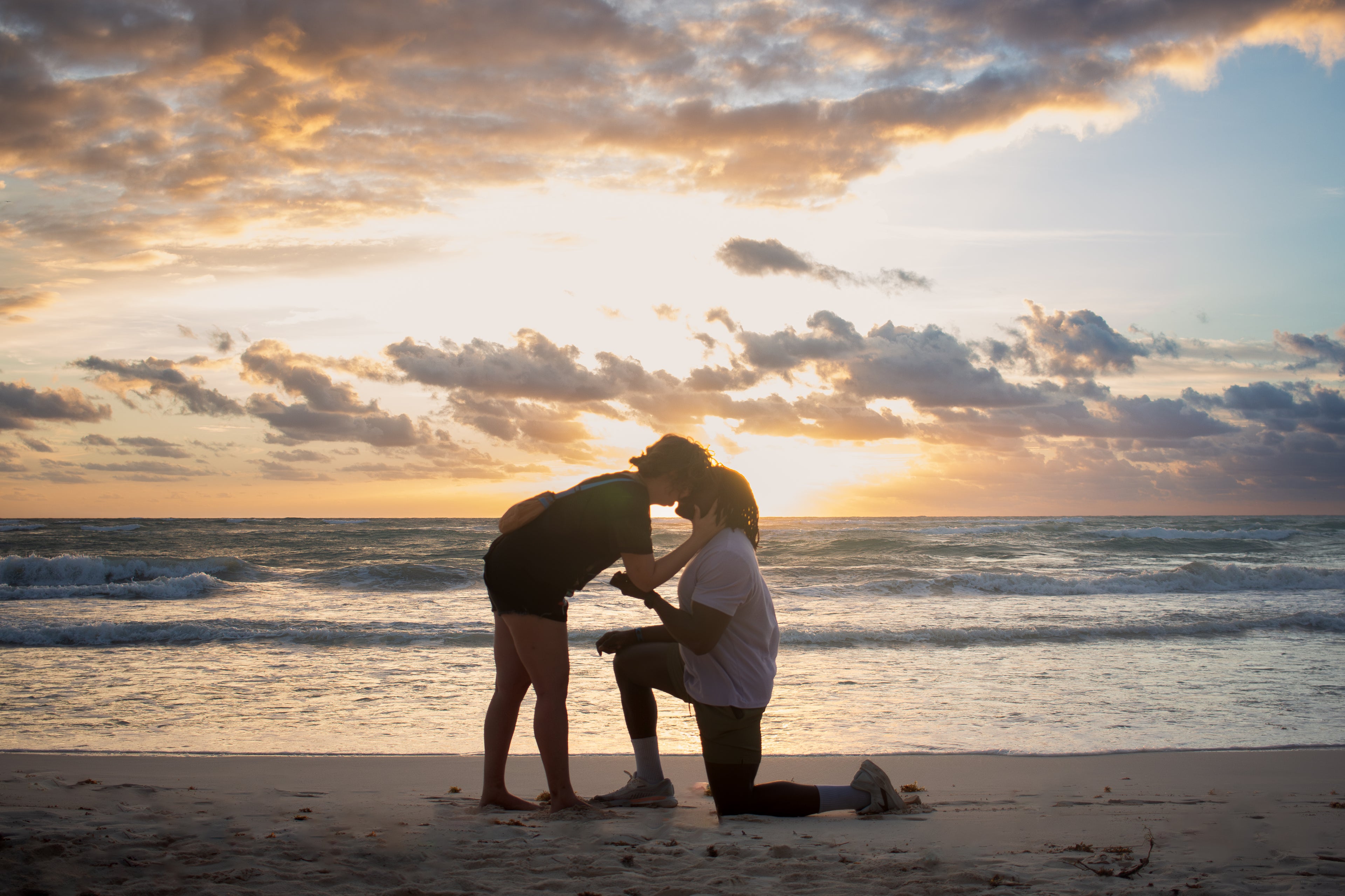 Romantic sunrise proposal on the beach in Tulum